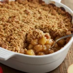 Gordon Ramsay Apple Crumble with golden topping in baking dish