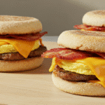 Gordon Ramsay breakfast sandwich with egg, cheddar, and bacon on English muffin