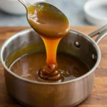 Gordon Ramsay Caramel Sauce dripping from spoon into saucepan