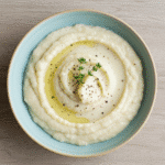 Served Gordon Ramsay cauliflower puree with olive oil and thyme