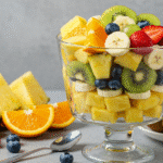 Gordon Ramsay Fruit Salad layered in a glass bowl with fresh fruit