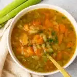 Carrot and Celery Soup in rustic bowl