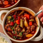 Cowboy Soup with beef and veggies in rustic bowl