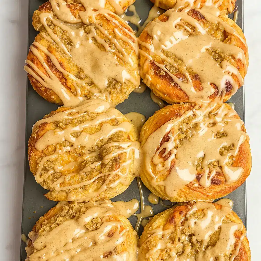 Pumpkin Cheesecake Cinnamon Rolls with streusel topping and pumpkin spice glaze