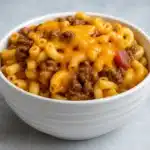 Crock Pot Cheddar Chili Mac in rustic bowl