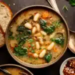Hearty Tuscan White Bean Soup in rustic bowl