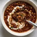 Hearty Vegan Chili in a rustic bowl with toppings