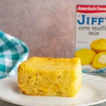 Jiffy Corn Casserole in white dish with golden top
