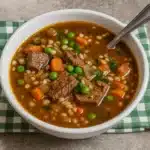 Pioneer Woman Beef Barley Soup in rustic bowl
