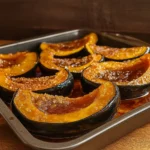 roasted acorn squash with brown sugar on rustic table