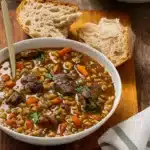 Slow Cooker Beef and Barley Soup in Rustic Bowl