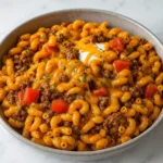 Cheesy Beef Taco Pasta in a skillet with melted cheese