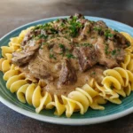 Easy Crockpot Beef Stroganoff in a rustic bowl