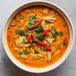 Easy Crockpot Thai Coconut Chicken Soup in a rustic kitchen