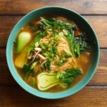 Ginger Garlic Noodle Soup with Bok Choy in ceramic bowl