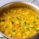 Green Thai Chicken Coconut Curry in skillet with rice