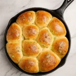 Herbed Potato Rolls fresh from oven in cast iron skillet