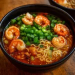 Spicy Shrimp Ramen in a bowl with chili broth and toppings