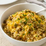 Cheesy Ground Beef and Rice Casserole in white baking dish