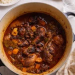 Jamaican Brown Stew Chicken served with rice and peas