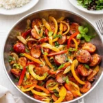 Sausage and Peppers in cast-iron skillet