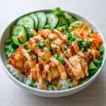 Bang Bang Chicken Rice Bowl with sauce and veggies
