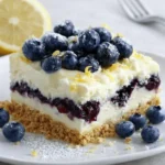 blueberry lemon heaven dessert slice with blueberries and lemon zest
