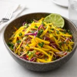 Easy Mango Slaw served in a bowl