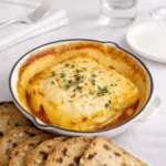 Hot Honey Baked Feta appetizer with thyme and pita chips