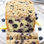 Lemon Blueberry Bread sliced on rustic kitchen counter