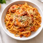 Shrimp Fra Diavolo pasta bowl with lemon zest and herbs