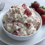 Strawberry Cheesecake Fluff Salad in a bowl with marshmallows