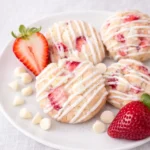 Strawberry Shortcake Cookies on a plate with glaze