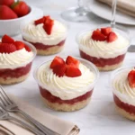 Strawberry Shortcake Dessert Cups in clear mini cups on rustic table