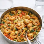 Tomato Zucchini Shrimp Pasta served in a bowl