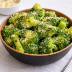 Copycat Longhorn Garlic Parmesan Broccoli in a white bowl