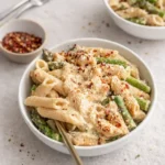 Creamy Vegan Lemon White Bean Pasta with asparagus in a bowl