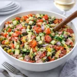 A bowl of colorful Gluten-free Italian Pasta Salad with fresh vegetables