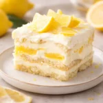 A refreshing Lemon Tiramisu garnished with lemon zest and mint.